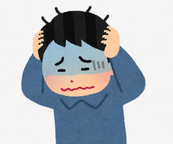 頭かかえこんで悩む人